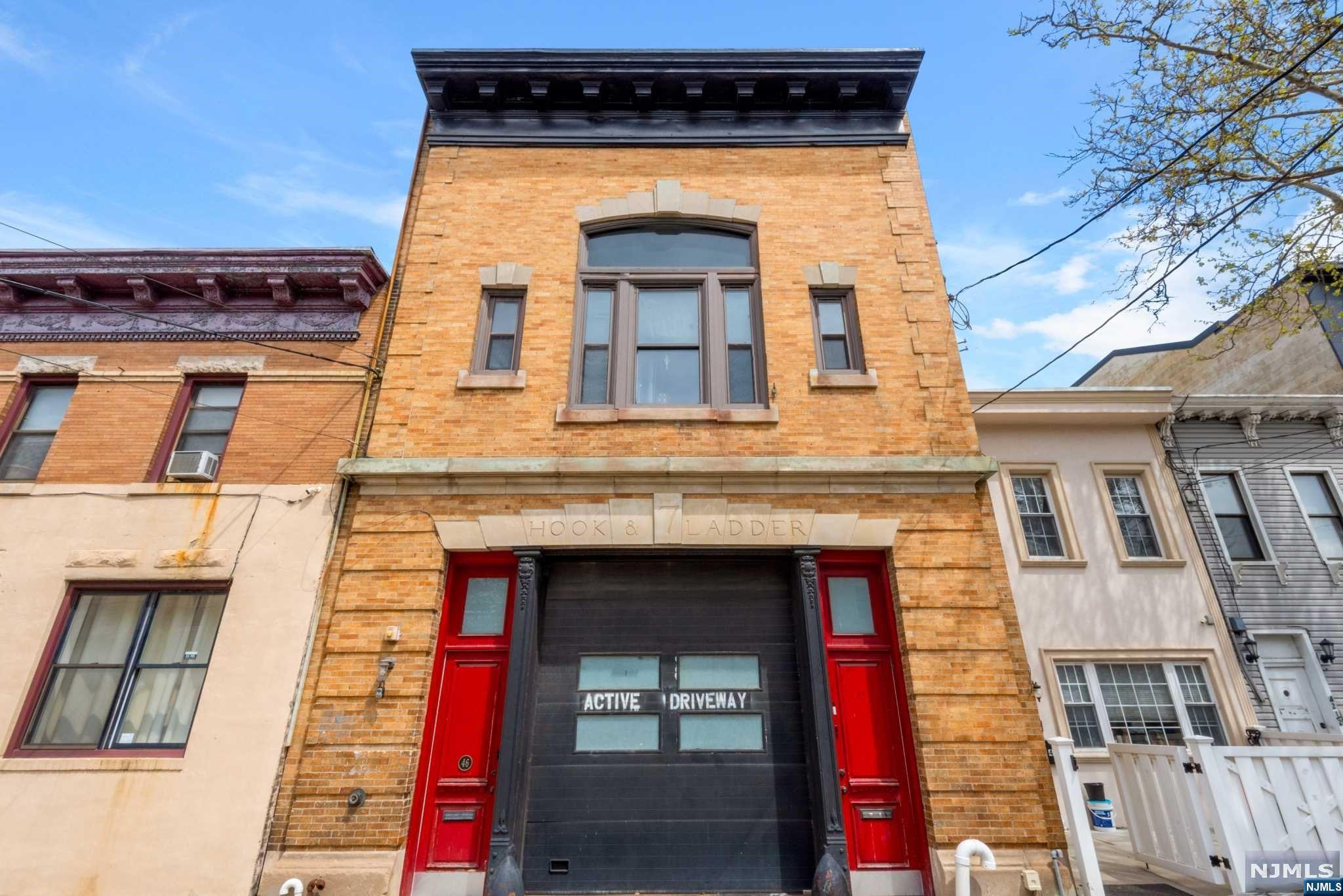 a view of building with a door and a clock