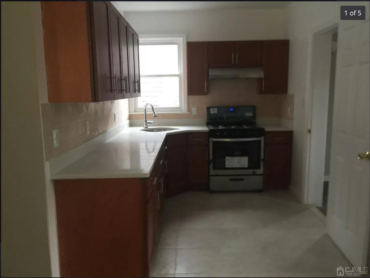 a kitchen with a stove and a refrigerator