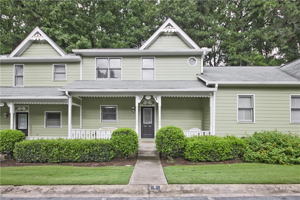 a front view of a house with yard