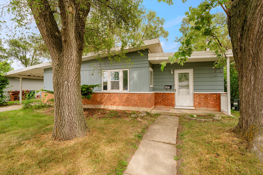 front view of a house with a yard