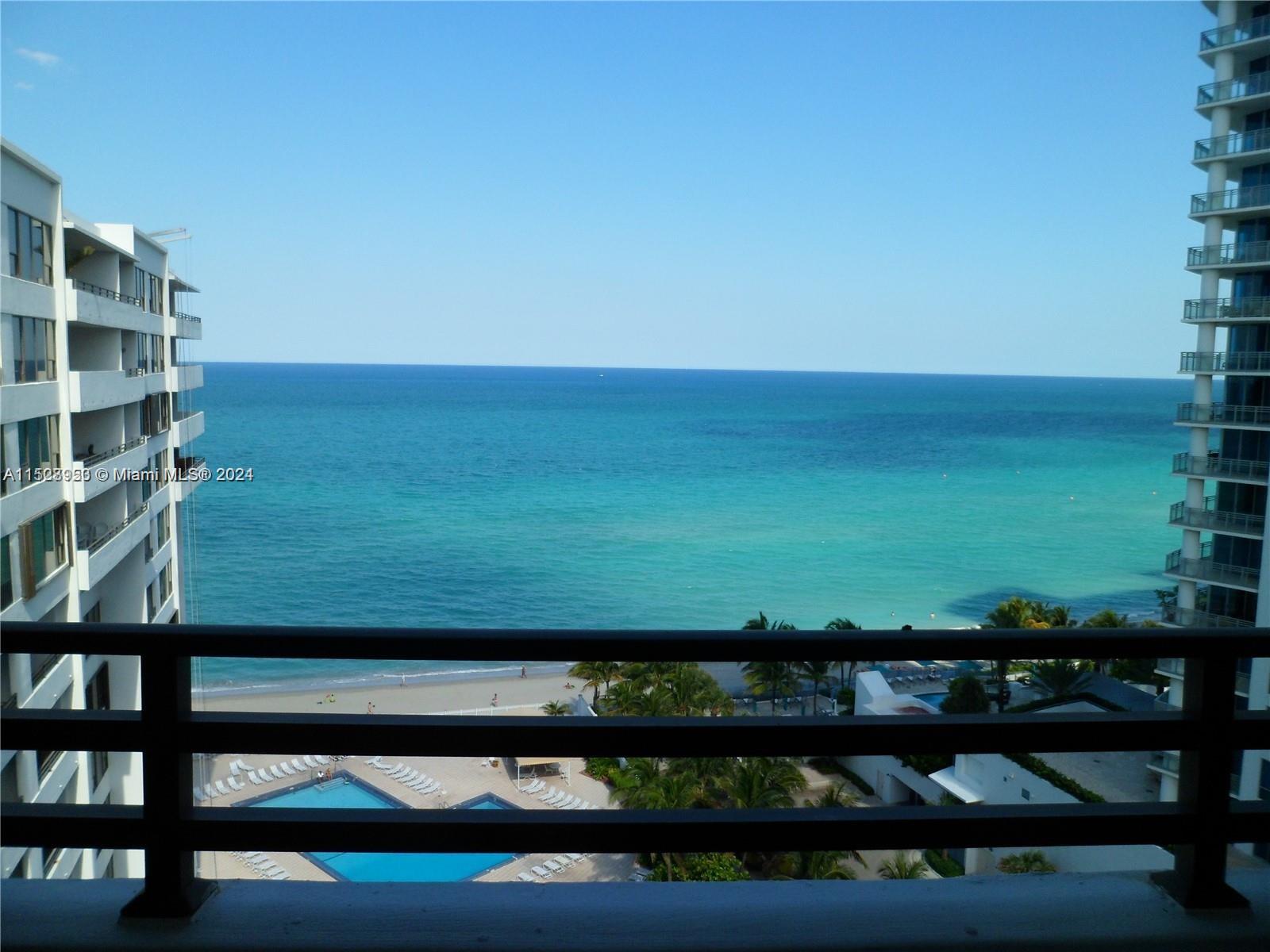 a view of swimming pool from a balcony