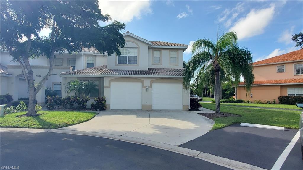 a house with palm tree in front of it