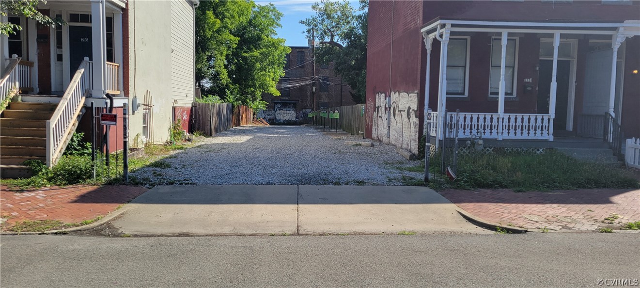 a view of a house with a small yard and plants