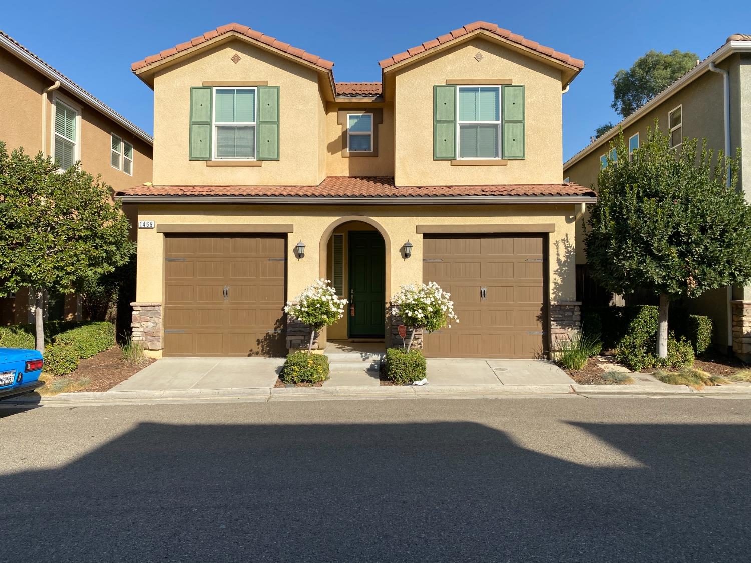 a front view of a house with a yard