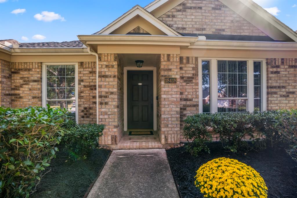 front view of a house with a garden