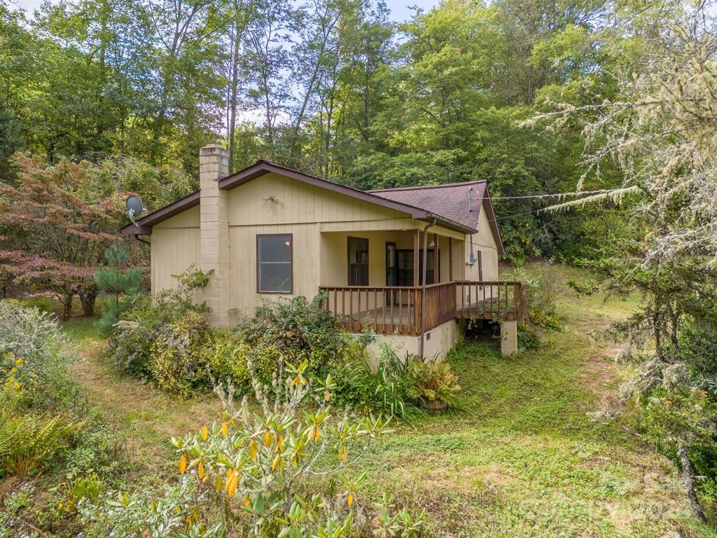 a house with trees in the background