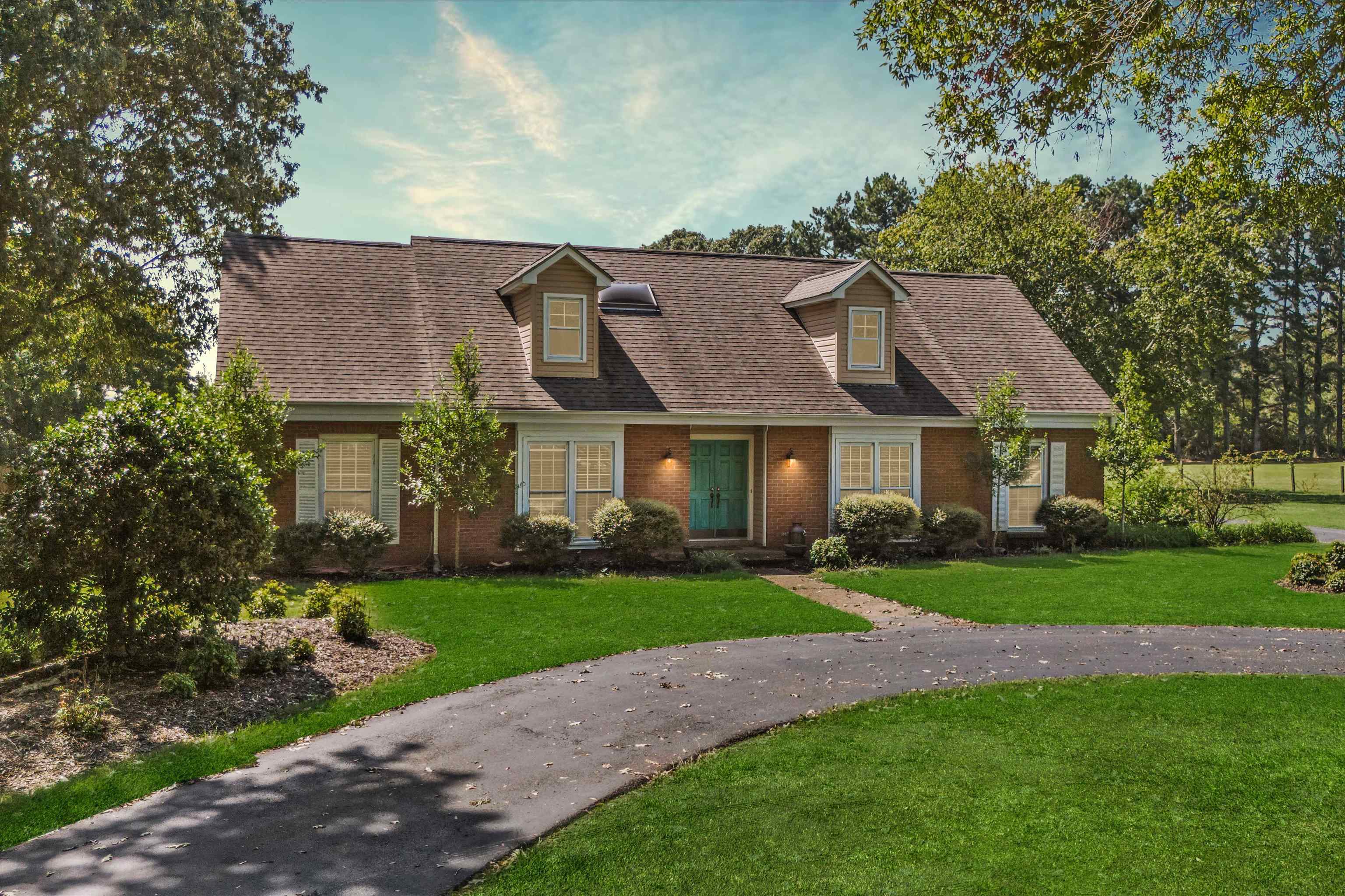 a view of a big yard in front of a house