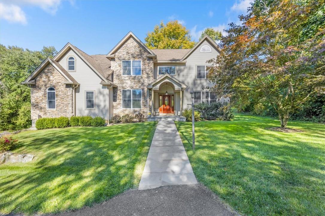 View of front of house featuring a front lawn