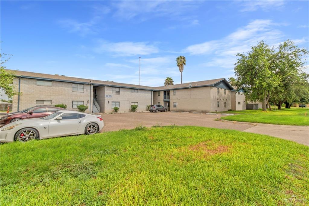 Single story home with a front lawn