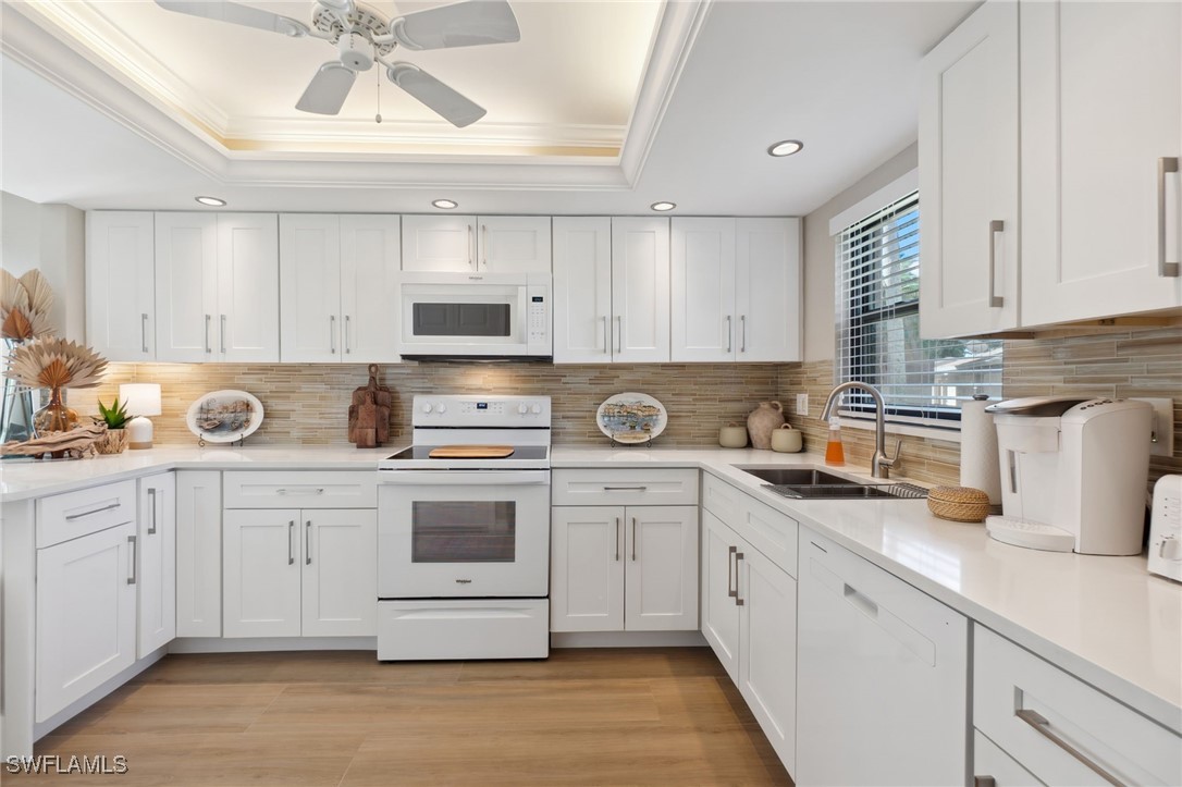 a kitchen with stainless steel appliances granite countertop a sink and cabinets