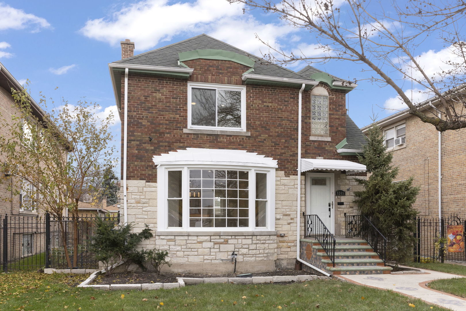 a front view of a house with a yard