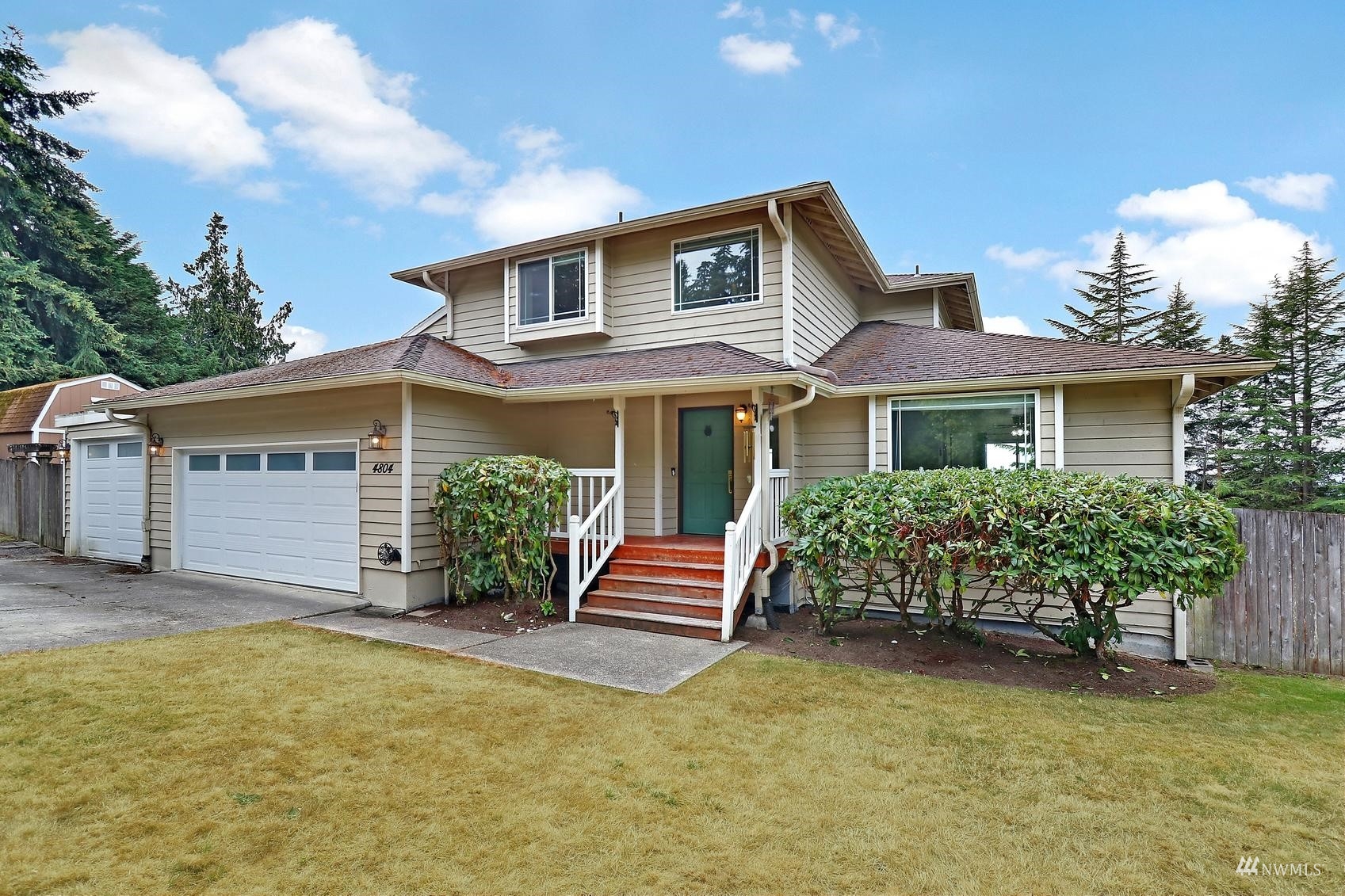 front view of a house with a yard