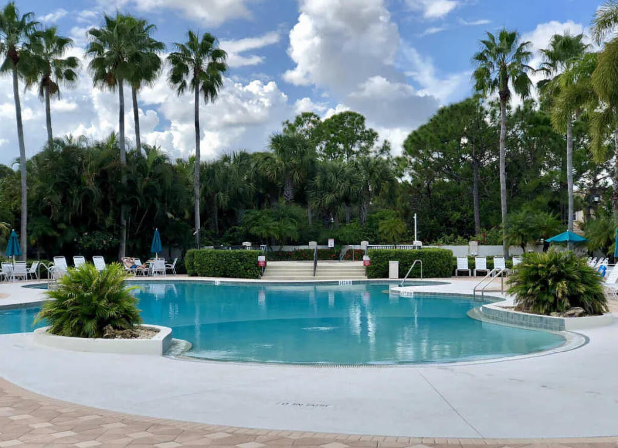 a view of a swimming pool with a patio