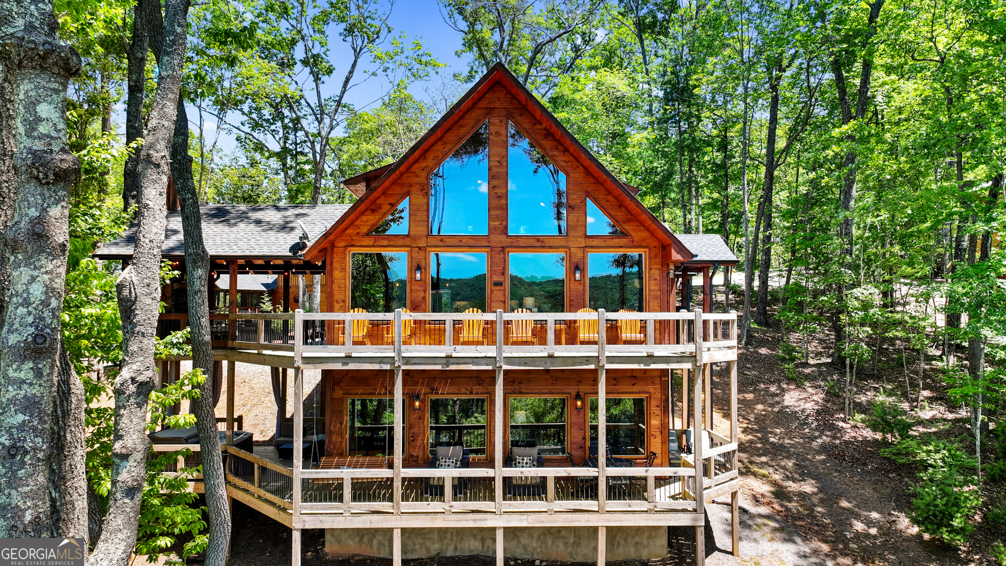 a view of a house with a yard and balcony