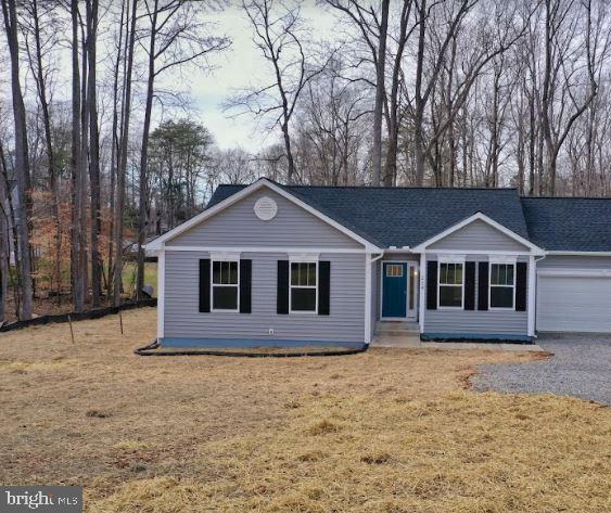 a front view of a house with yard