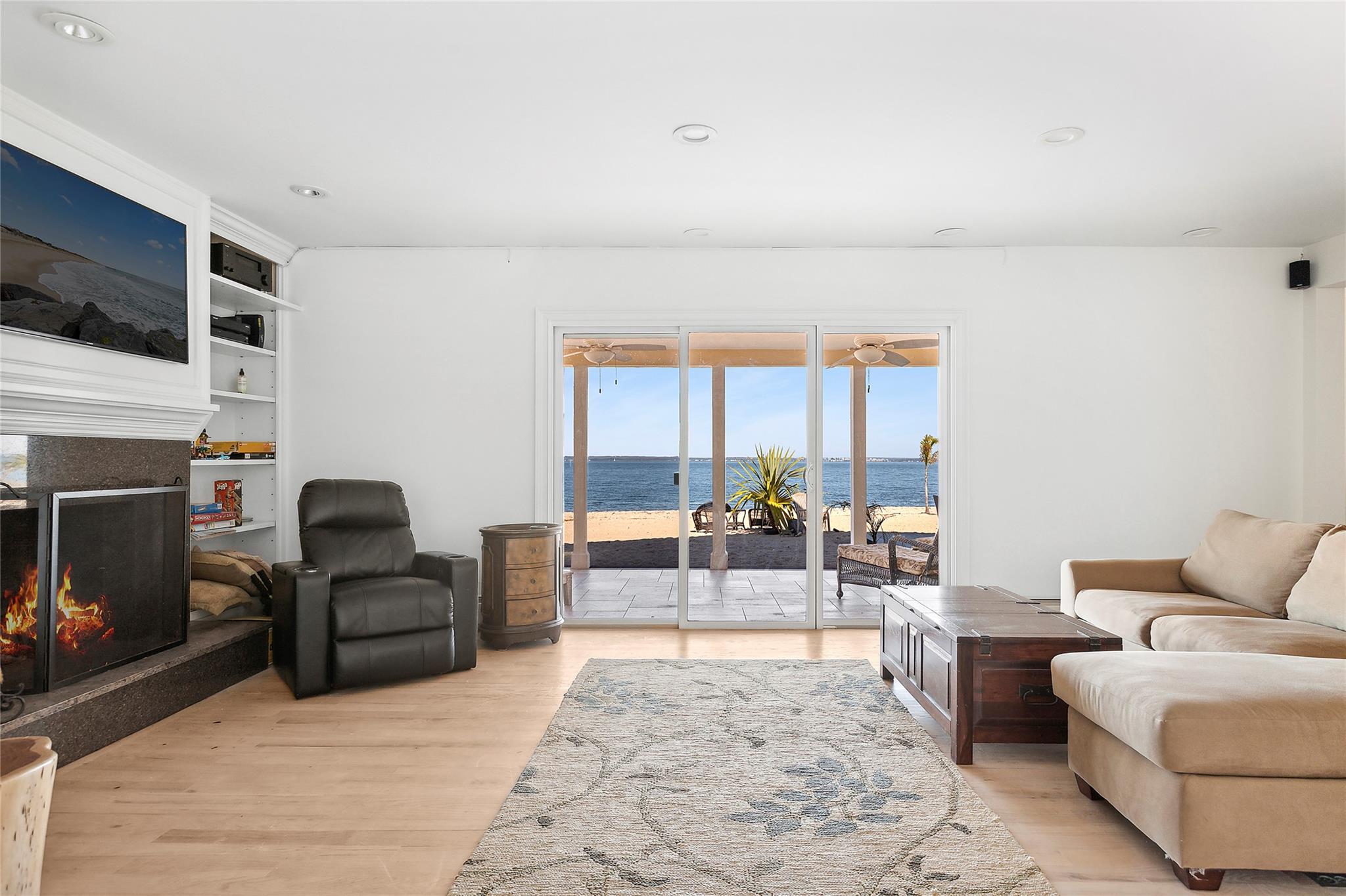 a living room with furniture fireplace and flat screen tv