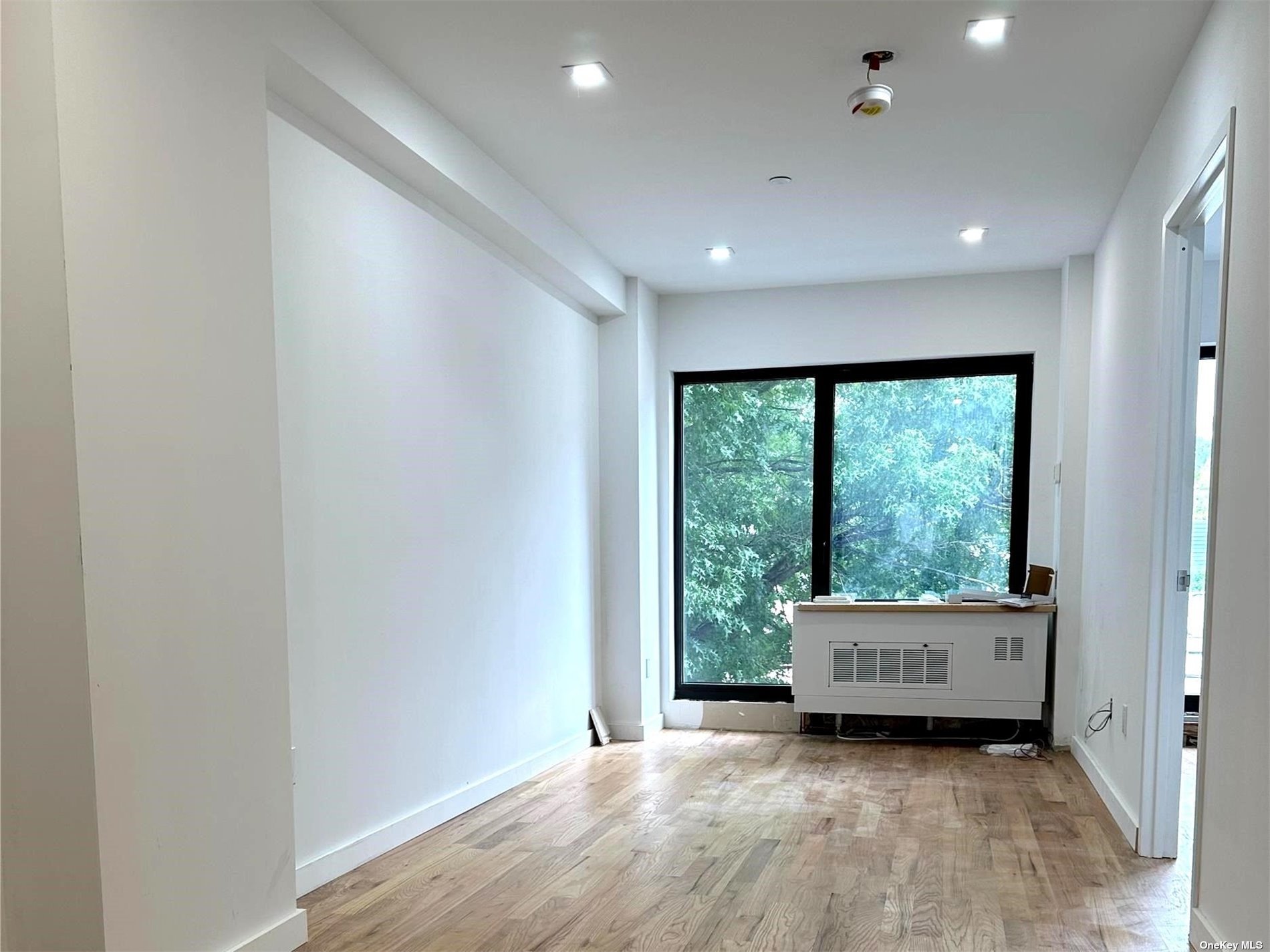 a view of an empty room with a large window