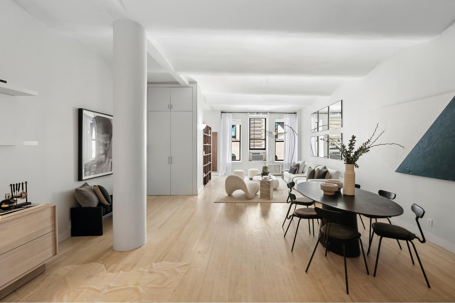 a view of a livingroom with furniture and a flat screen tv