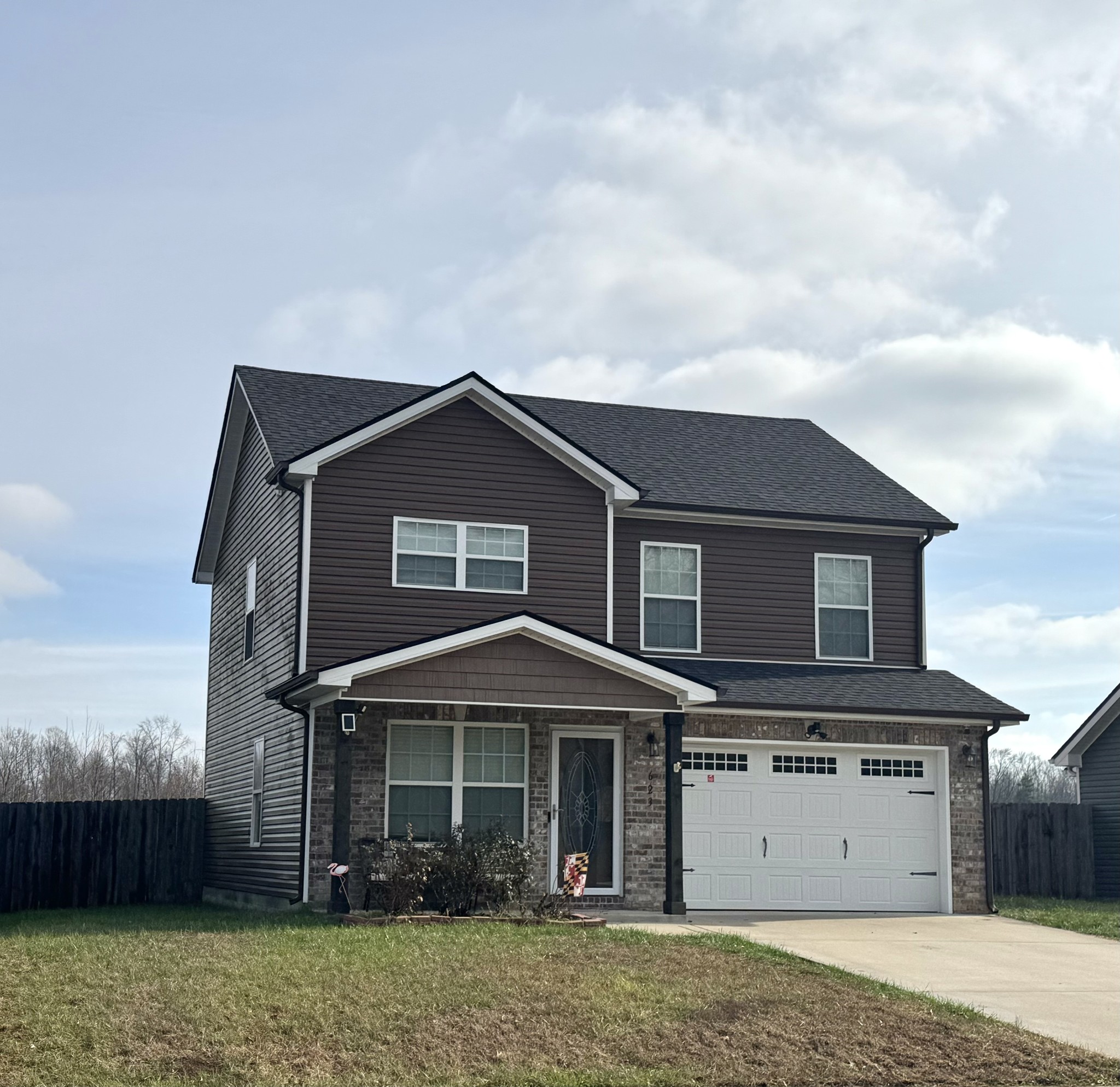 a front view of a house with a yard