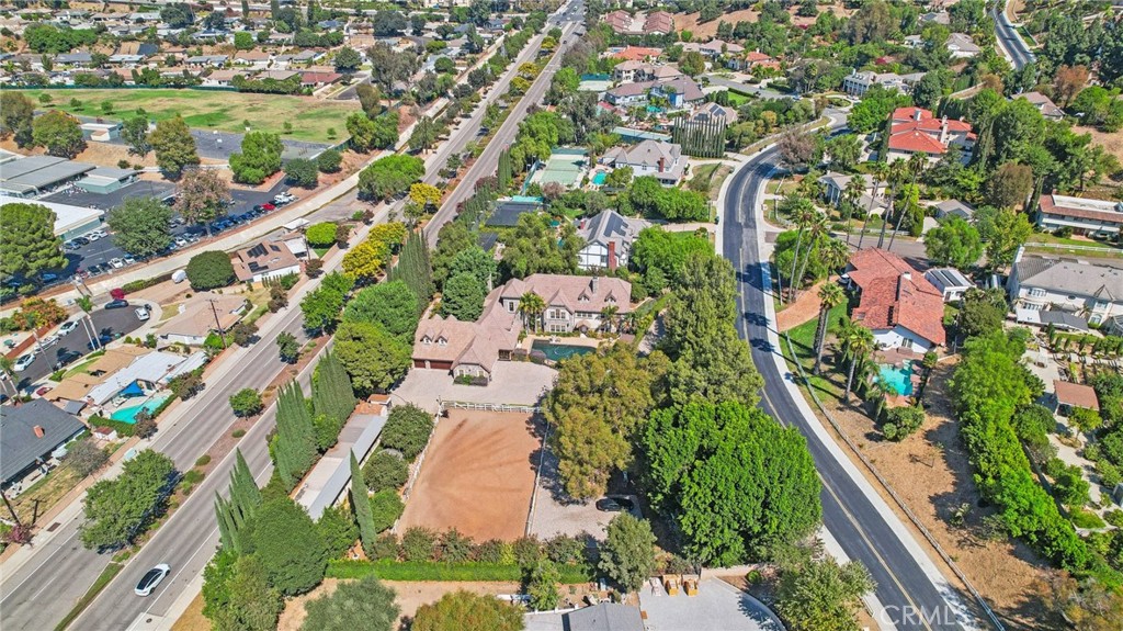 an aerial view of residential houses with outdoor space