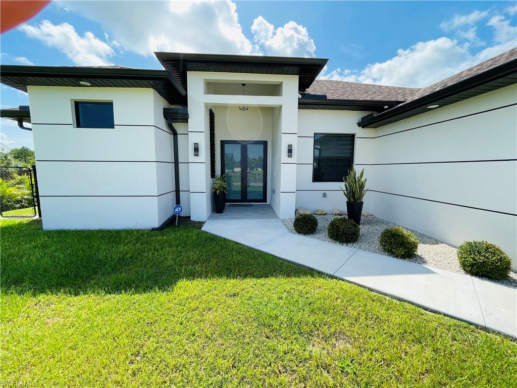 a front view of a house with a yard