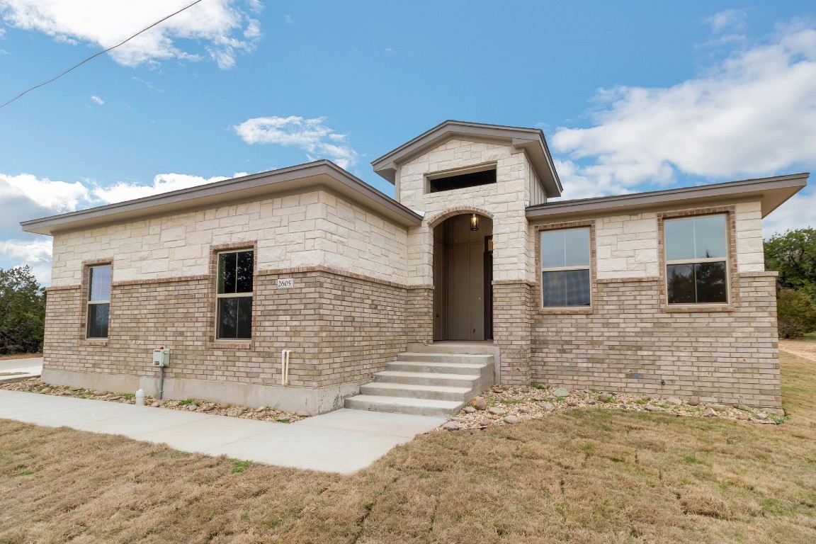 a front view of a house with parking