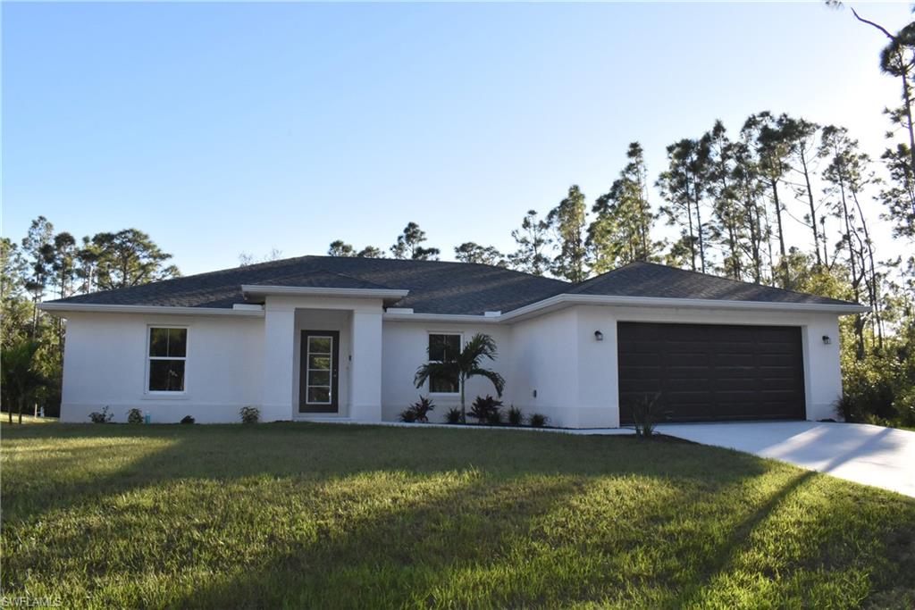 a front view of house with yard and seating area