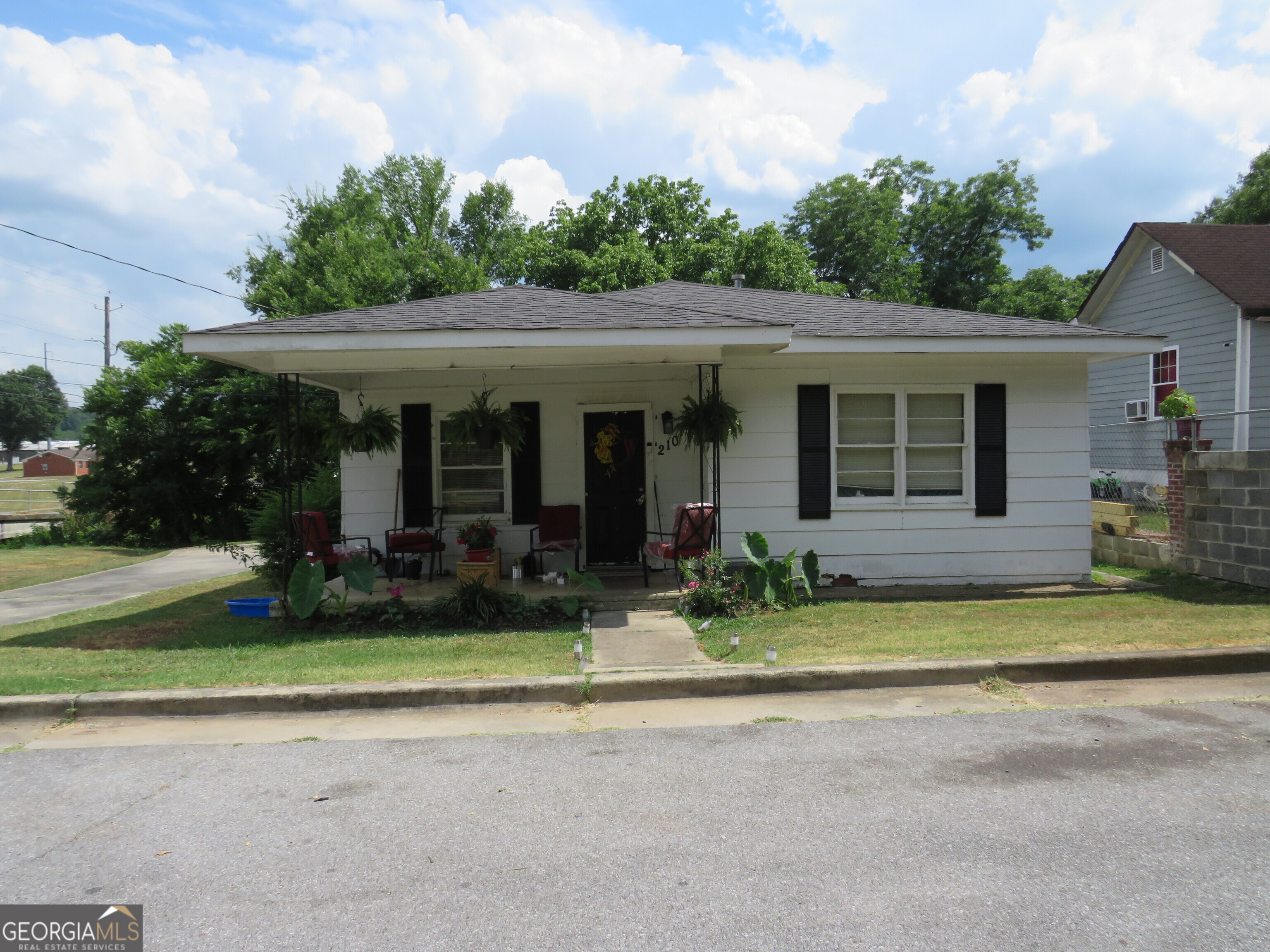 a view of a house with outdoor space and garden