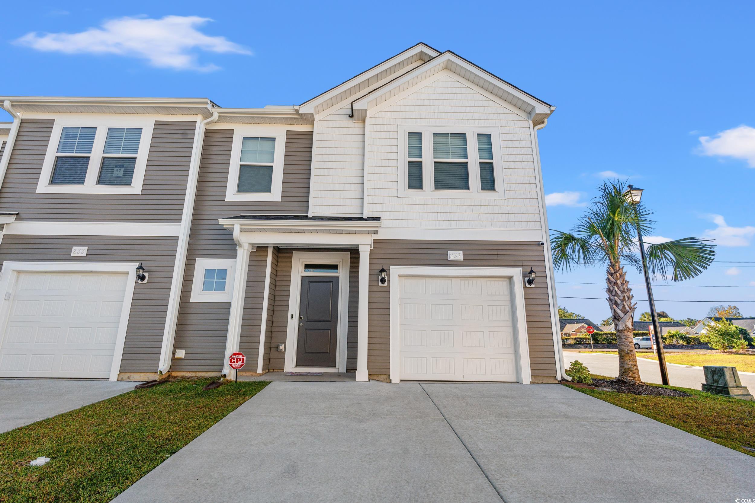 View of front of property with a garage