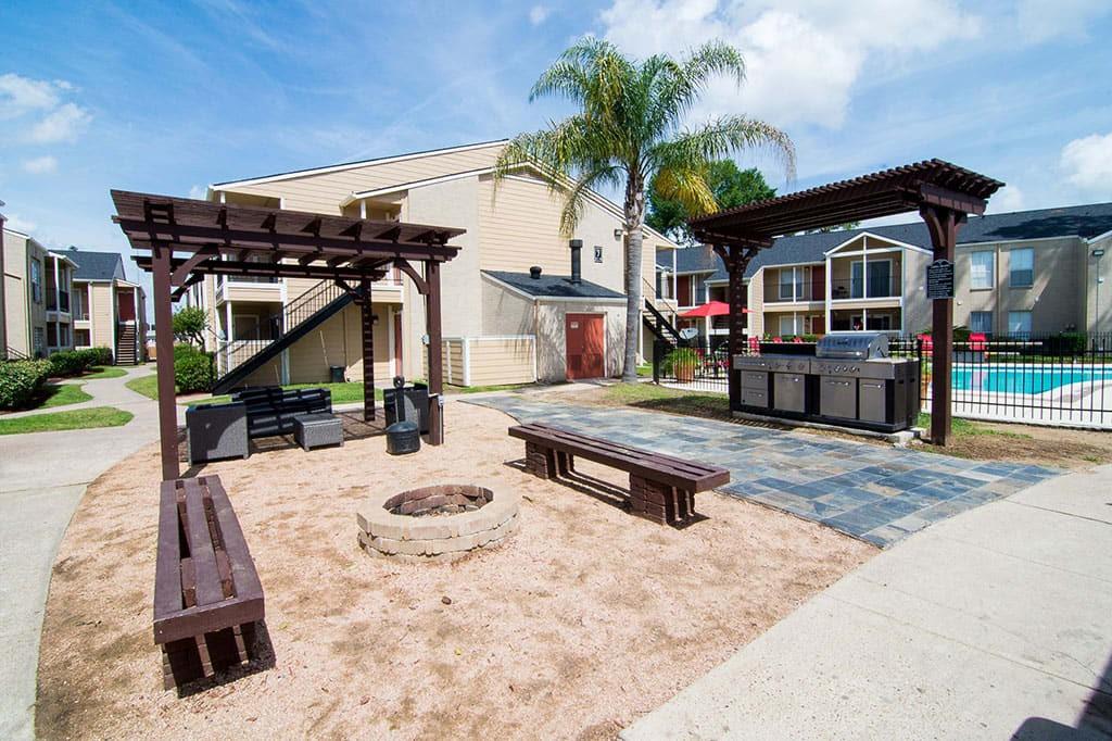 a view of a backyard with sitting area