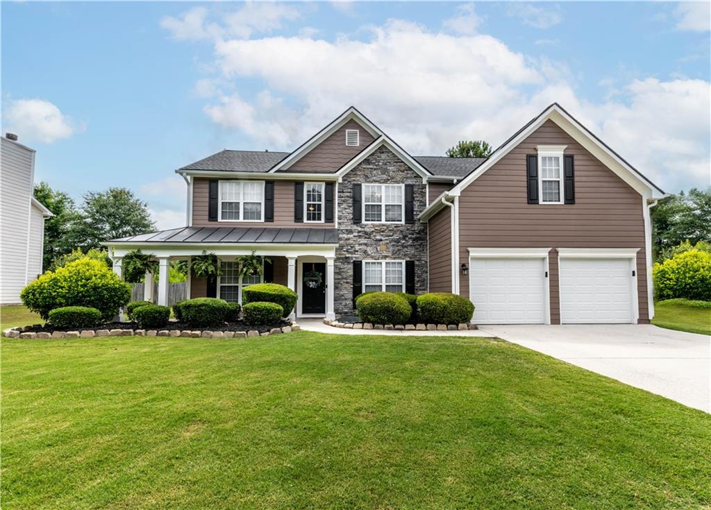 a view of a house with a yard