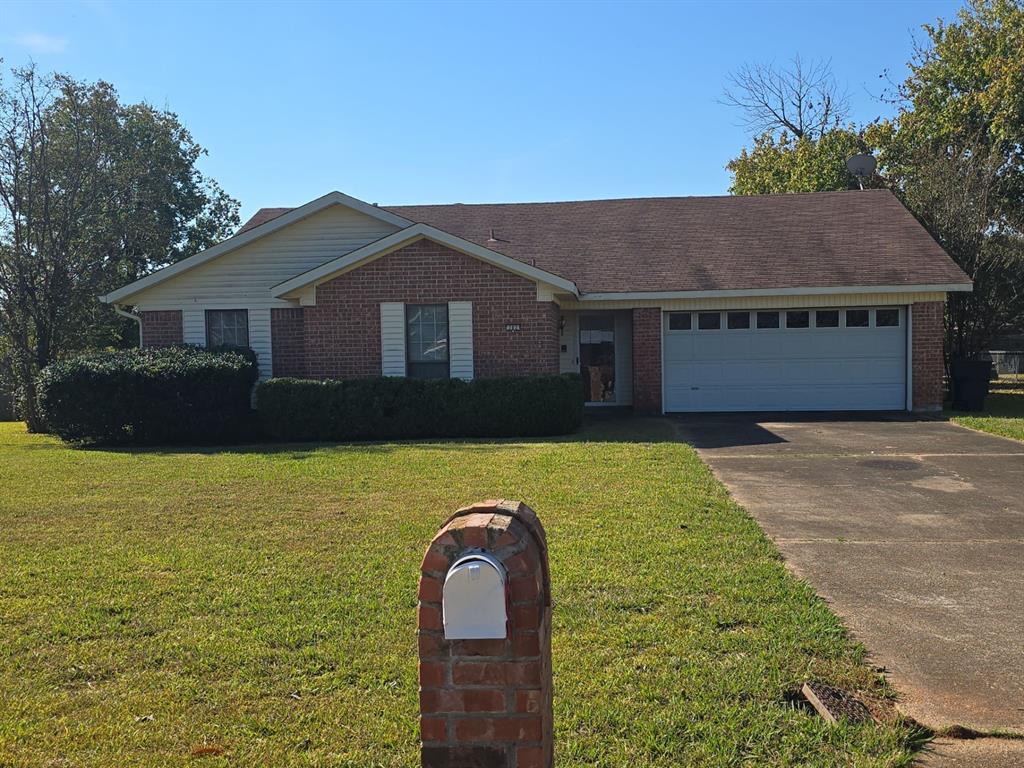 a front view of a house with yard