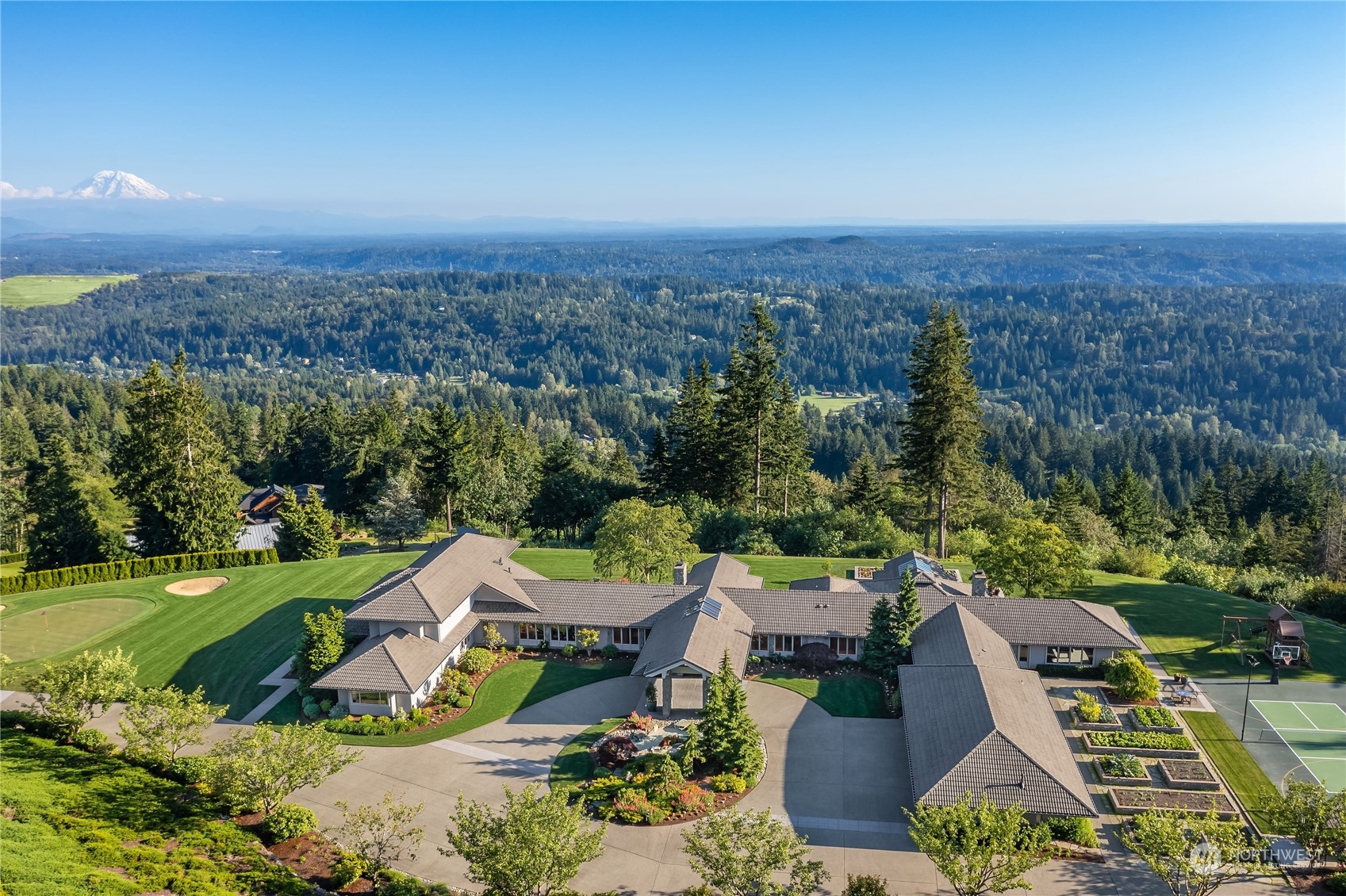 an aerial view of a house with garden space and street view