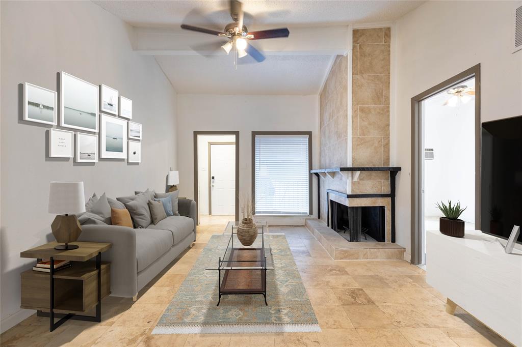 a living room with furniture a fireplace and a flat screen tv