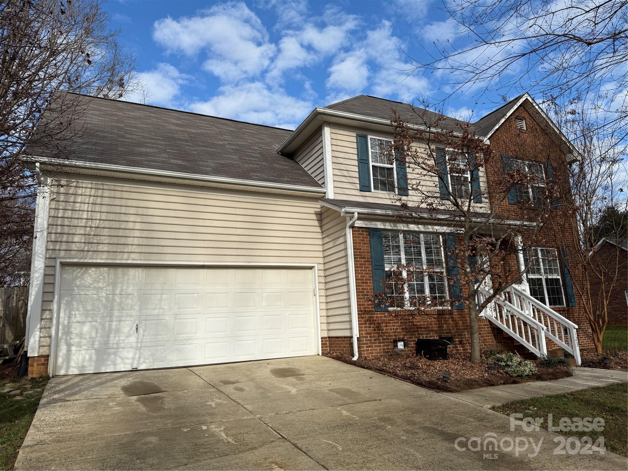 a front view of a house with a garage