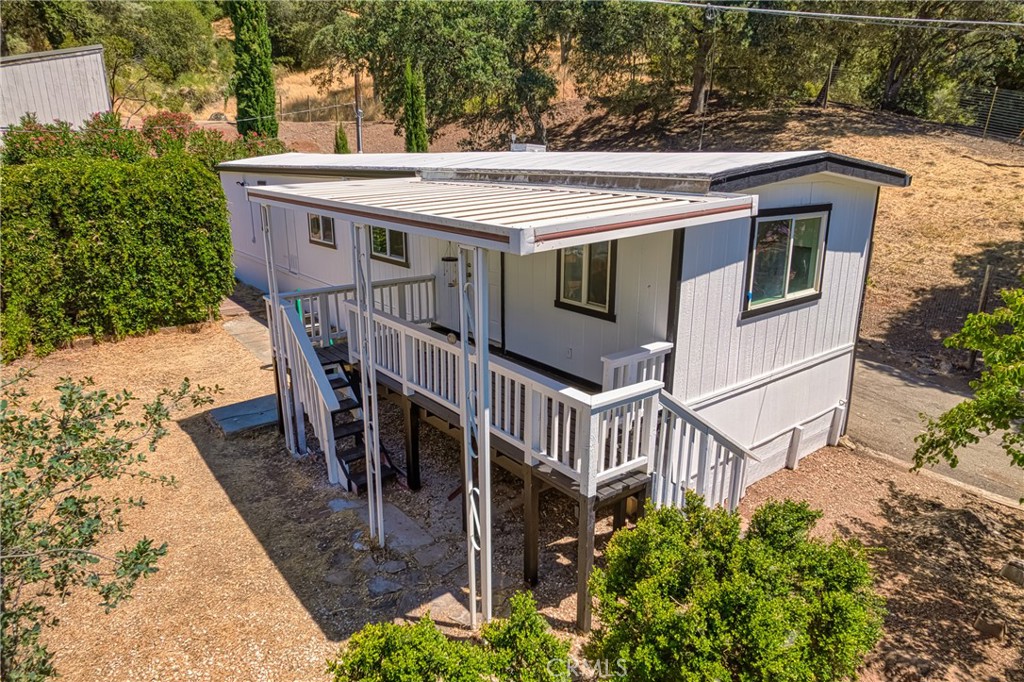 a view of a house with wooden floor and a lawn chairs