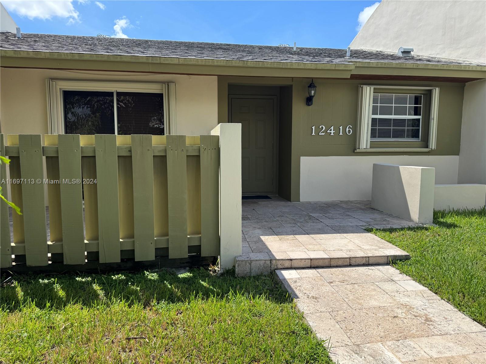 a view of a back yard of the house