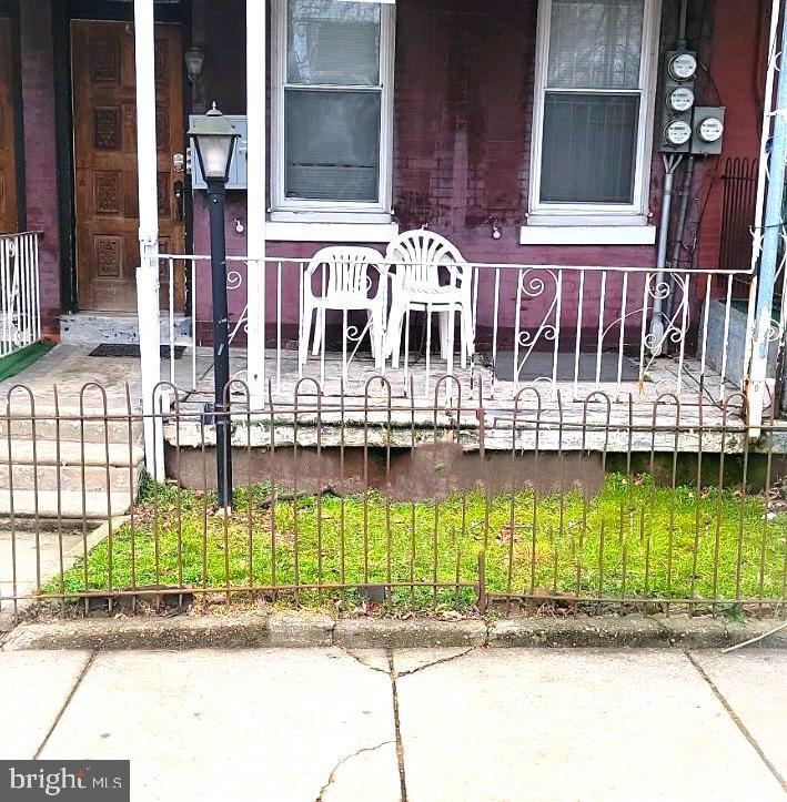 a front view of a house with a porch