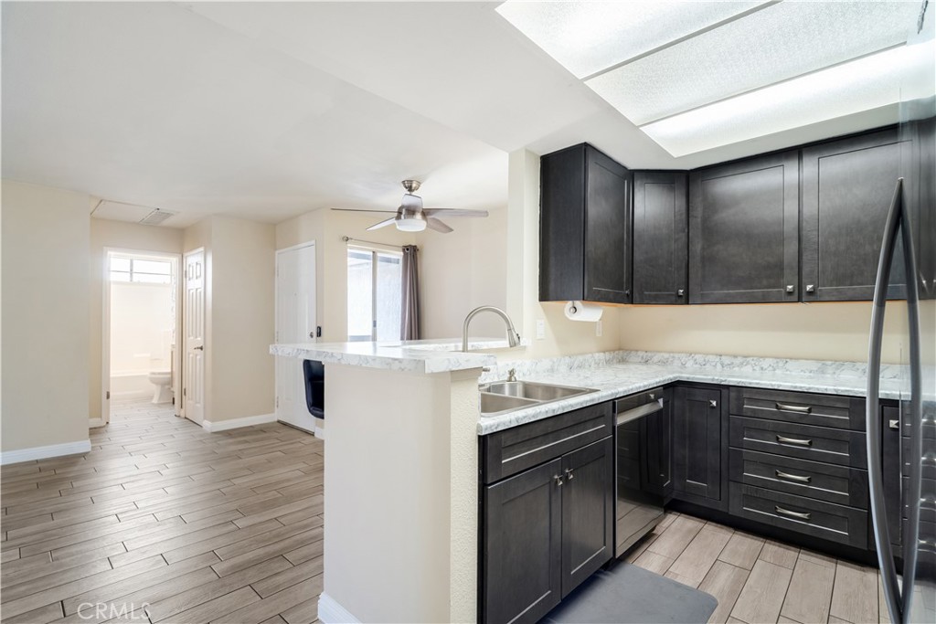 a kitchen with a sink and cabinets