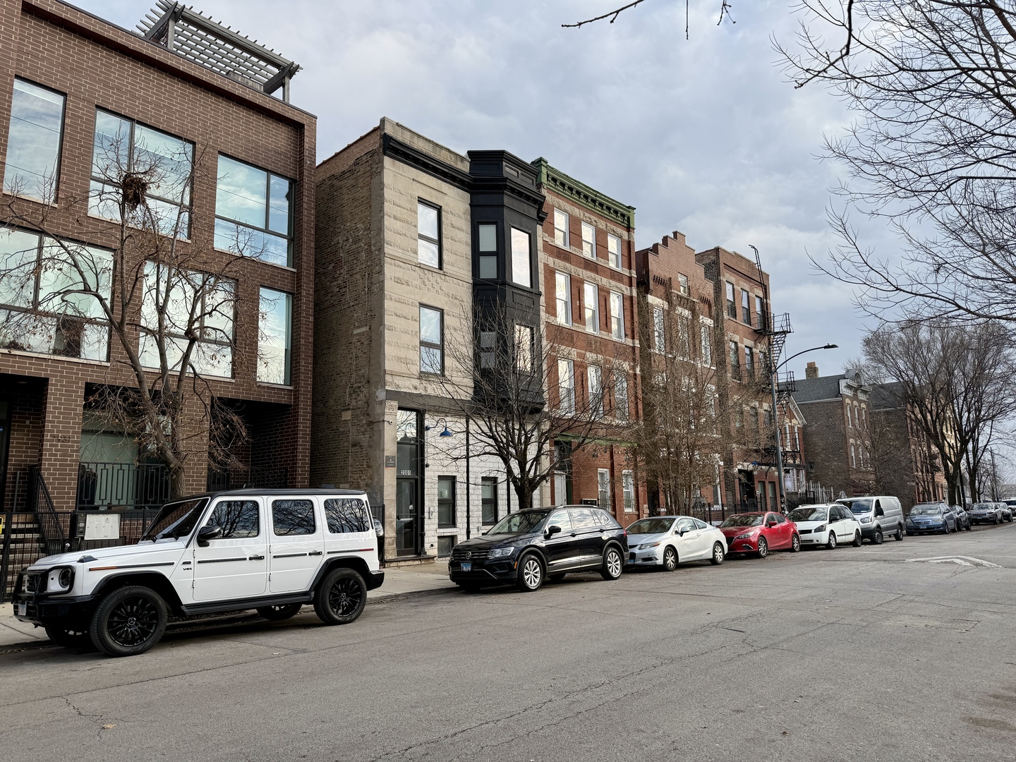 a view of cars parked in front of a building