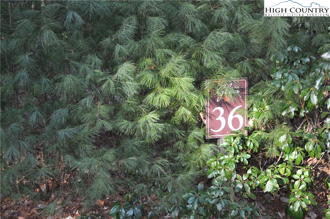 a sign that is sitting in a field