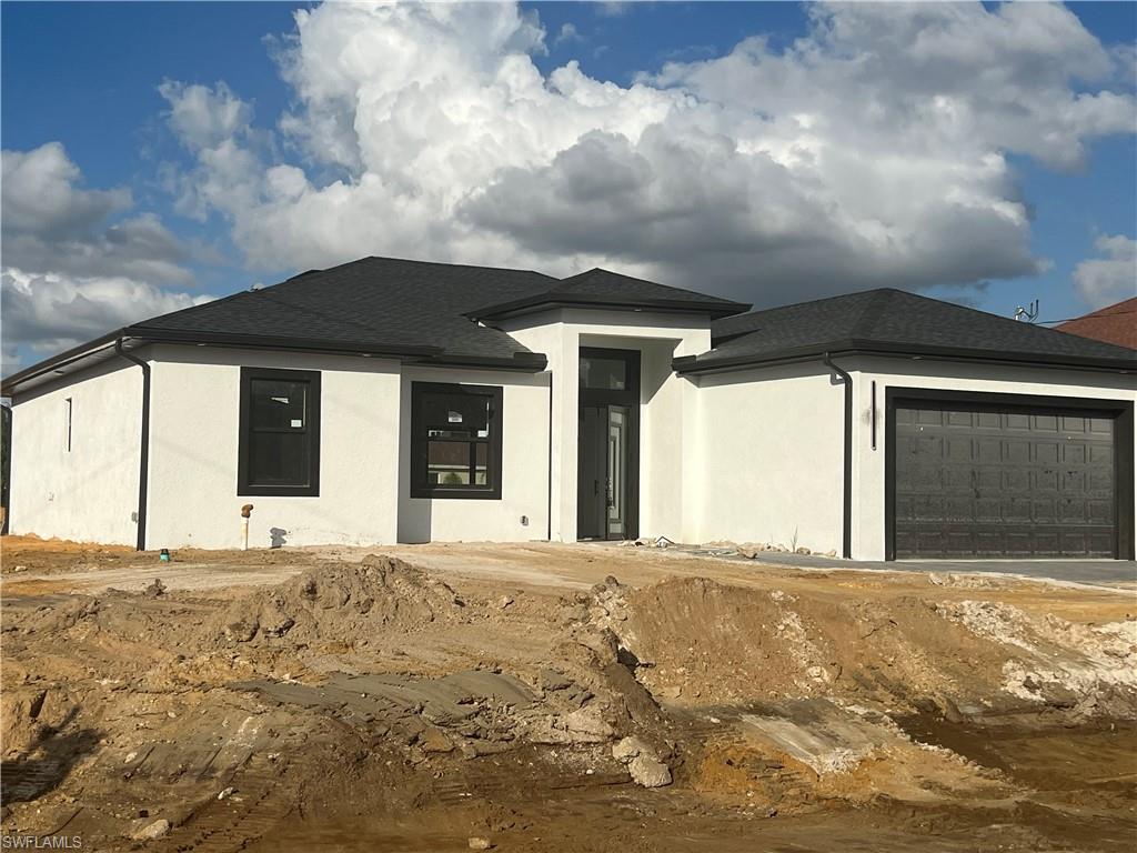 Prairie-style house with a garage