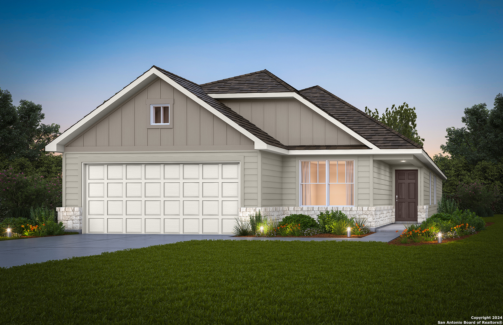 a front view of a house with a yard and garage