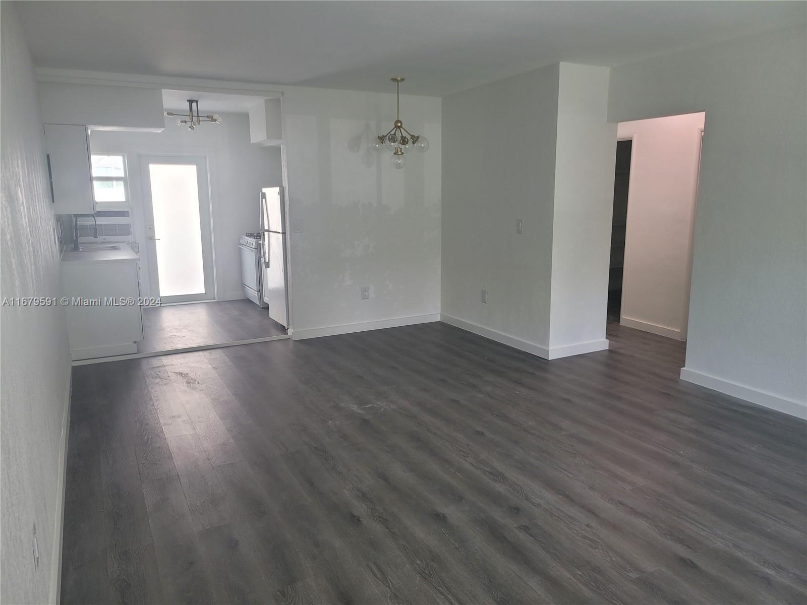 a view of a bathroom with wooden floor