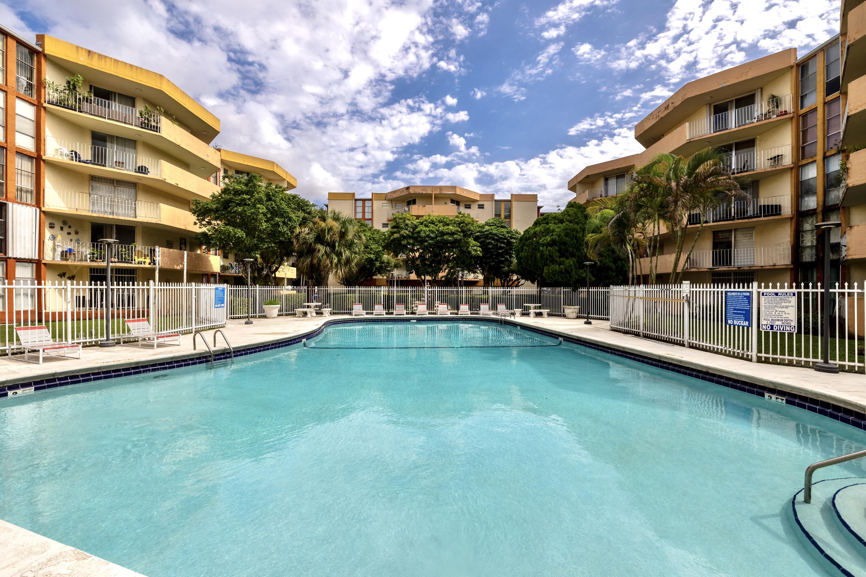 a view of a swimming pool with a patio