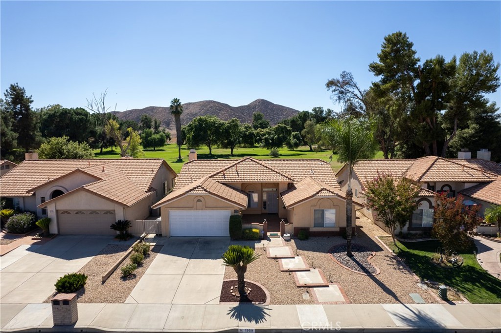 a aerial view of a house with a yard