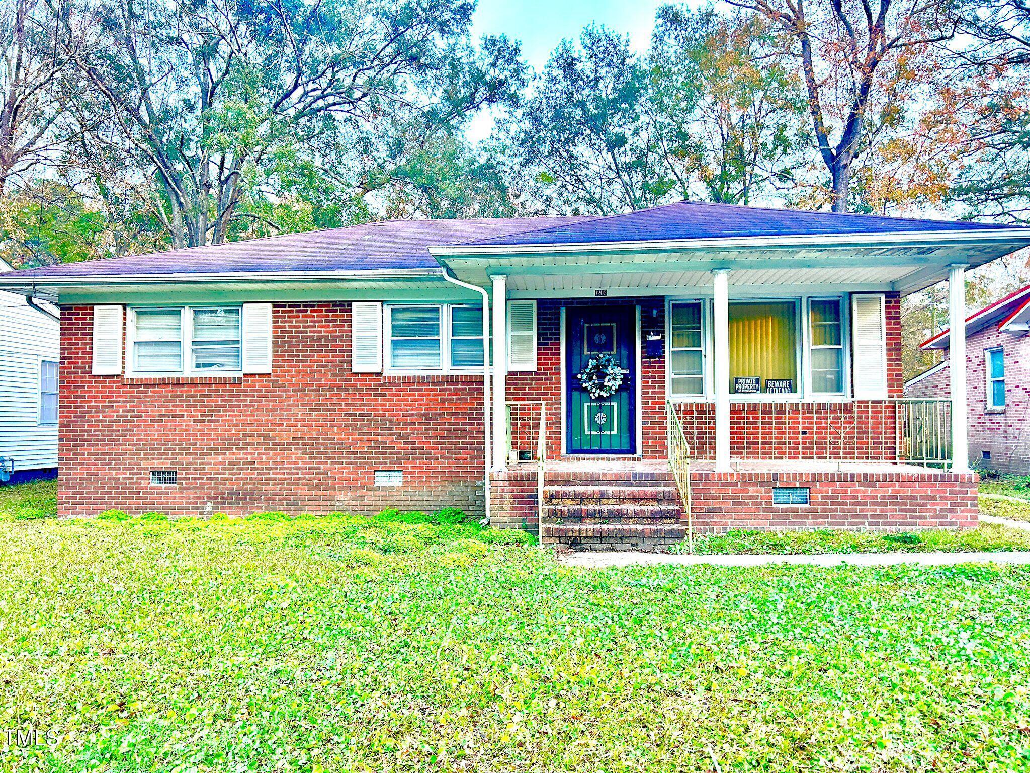 front view of a house with a yard