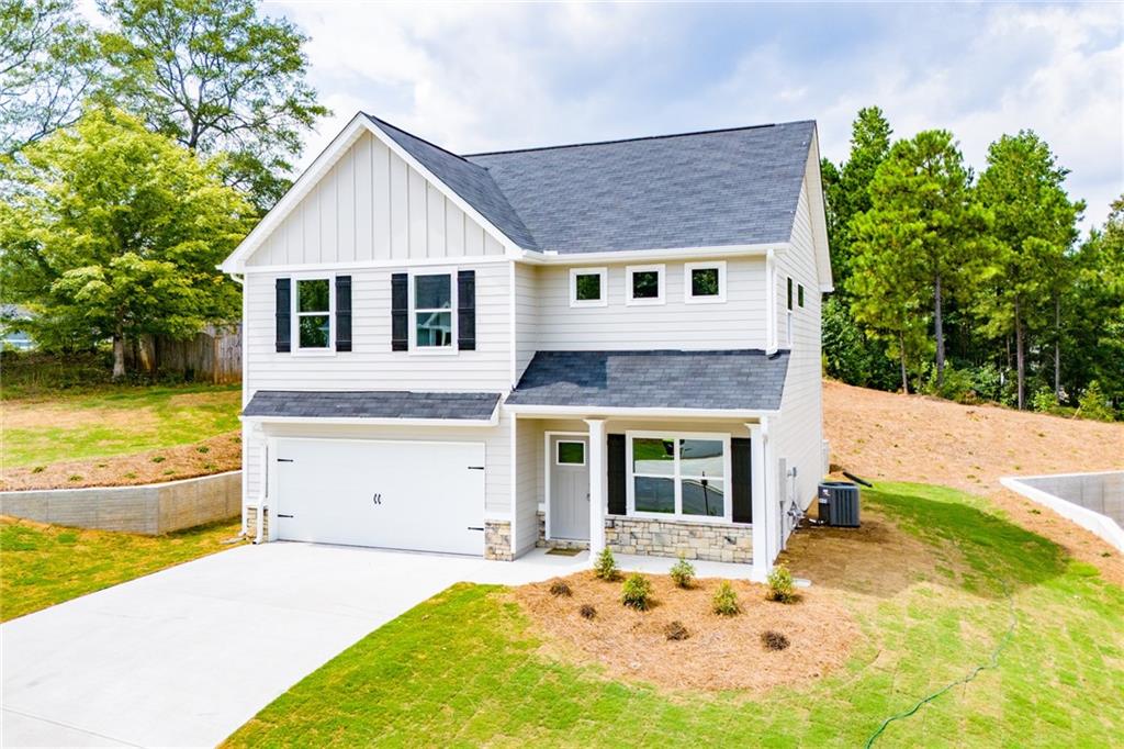 a front view of a house with a yard