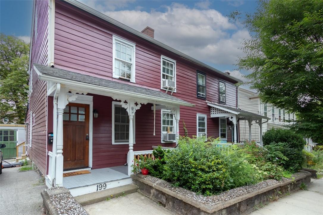 front view of a house with a small yard