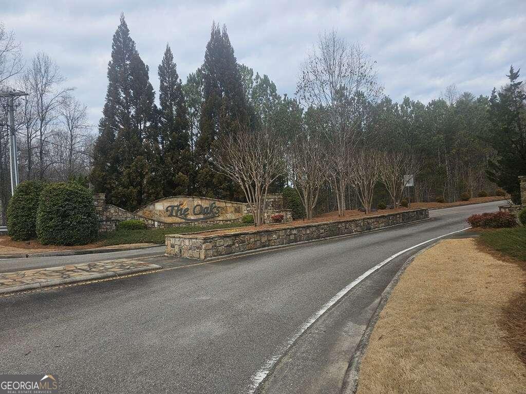 a view of a city street with a building in the background